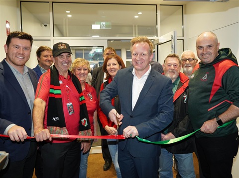 Group of smiling people at the Pat Rollo Pavilion ribbon cutting ceremony